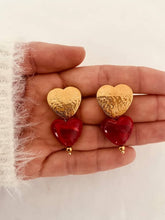 Load image into Gallery viewer, Gold heart earrings with red resin detail.
