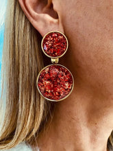 Load image into Gallery viewer, Model wearing NYOKO red resin statement earrings styled for an elegant everyday look.
