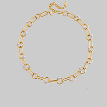 Load image into Gallery viewer, Elevate your everyday look with the Classic Minimalist Choker Necklace, featuring a delicate hollow design with an elegant inlay pearl. Crafted from durable waterproof stainless steel and finished with luxurious 18K gold color plating, this necklace offers long-lasting shine and comfort. Its clean, modern style makes it perfect for layering or wearing alone, adding a touch of timeless elegance to any outfit—from casual wear to special occasions.
