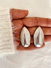 Load image into Gallery viewer, Modern sculptural leaf earrings in silver.
