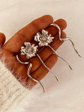 Load image into Gallery viewer, Silver wave earrings with contemporary design.

