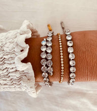 Load image into Gallery viewer, Close-up of gold zircon bracelet capturing shine and crystal clarity
