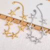 Close-up of gold starfish bracelet showing detailed texture and refined craftsmanship