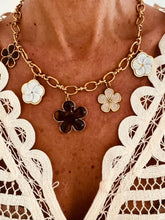 Učitaj sliku u preglednik galerije, Gold flower charm necklace displayed flat showcasing the elegant enamel floral pendants arranged across the chunky gold chain.
