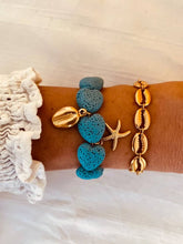 Load image into Gallery viewer, Ocean-inspired bracelet styled on the wrist for a summer look.
