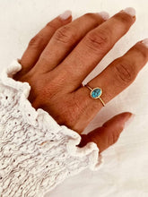 Load image into Gallery viewer, Gold plated stainless steel ring featuring a delicate turquoise stone-effect centre
