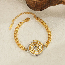 Load image into Gallery viewer, Close-up of gold and silver bracelet with disc pendant showcasing modern elegant design
