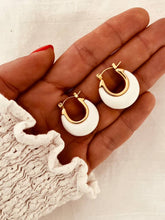 Učitaj sliku u preglednik galerije, Macro shot of white acrylic earrings capturing smooth texture and subtle gold accent
