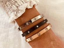 Load image into Gallery viewer, Close-up of zircon bracelet on wrist capturing sparkle and polished finish
