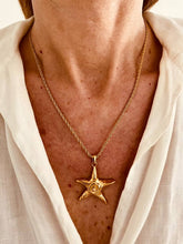 Load image into Gallery viewer, Woman wearing starfish necklace styled with summer outfit
