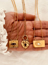 Load image into Gallery viewer, Bold gold necklace with rectangular sun pendant and textured ray pattern
