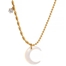 Load image into Gallery viewer, Close up of celestial necklace with white shell moon pendant and cubic zirconia accent
