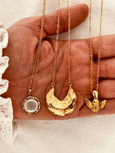Load image into Gallery viewer, Gold crescent moon necklace styled as a glamorous celestial accessory
