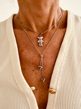 Load image into Gallery viewer, Lifestyle image showing necklace worn naturally highlighting comfort and adjustable fit
