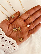 Load image into Gallery viewer, Double pearl necklace styled with additional chains to demonstrate layering potential and modern jewelry trends
