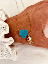 Load image into Gallery viewer, Gold necklace featuring a turquoise heart centerpiece and zircon pendant
