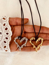 Load image into Gallery viewer, hollow lava heart pendant necklace close up gold and silver stainless steel detail
