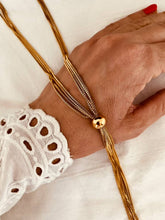 Load image into Gallery viewer, Gold tassel chain necklace with long stainless steel chain and elegant drop design
