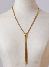 Load image into Gallery viewer, Front view of gold tassel necklace with sleek vertical drop design
