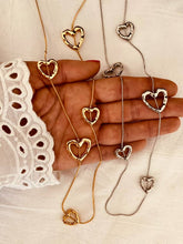 Load image into Gallery viewer, Gold and silver heart charm necklace on long chain
