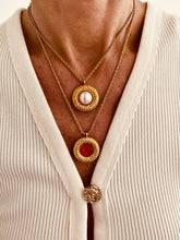 Load image into Gallery viewer, Close up on model neck showing how medallion pendant sits and enhances neckline styling
