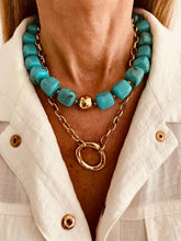 Load image into Gallery viewer, Turquoise beaded necklace with gold chain on a person wearing a white shirt.
