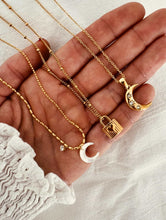 Load image into Gallery viewer, close up of moon pendant with sparkling cubic zirconia
