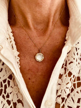 Učitaj sliku u preglednik galerije, Natural shell pendant necklace worn on model with fine gold chain
