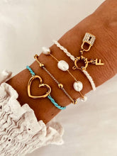 Load image into Gallery viewer, Lightweight adjustable bracelet with braided cord and gold-plated openwork charm
