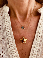 Load image into Gallery viewer, Starfish charm necklace worn on model styled with summer outfit showing beach inspired aesthetic
