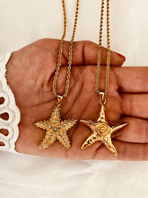 Load image into Gallery viewer, Flat lay of starfish necklace with stainless steel chain
