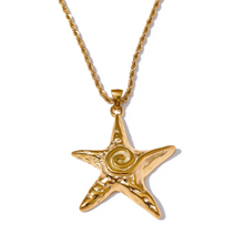Load image into Gallery viewer, Close-up of starfish pendant necklace showing carved spiral details

