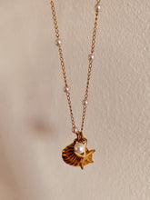Load image into Gallery viewer, starfish and seashell pendants necklace styled with summer beach outfit
